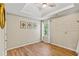 Bright bedroom with wood floors, natural light, and neutral wall color at 5655 Hedge Brook Dr, Cumming, GA 30028
