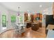 Bright eat-in kitchen featuring stainless steel appliances and a view to the deck at 5655 Hedge Brook Dr, Cumming, GA 30028