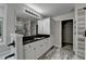 Well-lit primary bathroom featuring granite countertop vanity, and walk in shower at 179 Carter Rd, Auburn, GA 30011