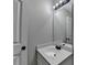 Bright bathroom with sleek vanity, updated fixtures, and modern mirror for a clean, stylish look at 179 Carter Rd, Auburn, GA 30011