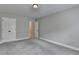 Spacious bedroom features neutral paint, plush carpeting and double door closet providing ample storage at 179 Carter Rd, Auburn, GA 30011