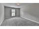 Bedroom with carpet, neutral paint, base molding and window at 179 Carter Rd, Auburn, GA 30011