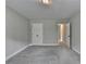 Bedroom featuring carpet, base molding, neutral paint, two doors and closet at 179 Carter Rd, Auburn, GA 30011