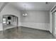 Dining room with hardwood floors connecting to a living room with fireplace and built-in shelving at 179 Carter Rd, Auburn, GA 30011