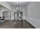 Dining room with hardwood floors opening to a living area with fireplace and a kitchen with breakfast bar at 179 Carter Rd, Auburn, GA 30011