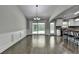 Dining area with hardwood floors, elegant wainscoting, and sliding doors to the outdoor space at 179 Carter Rd, Auburn, GA 30011
