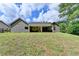 Back exterior view of home featuring a covered patio, a spacious yard, and modern siding at 179 Carter Rd, Auburn, GA 30011