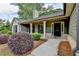 Inviting covered porch with decorative columns and a modern front door at 179 Carter Rd, Auburn, GA 30011
