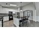 Well-appointed kitchen featuring granite countertops, white cabinetry, and stainless steel appliances at 179 Carter Rd, Auburn, GA 30011