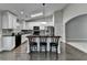 Stylish kitchen with white cabinets, granite countertops, stainless steel appliances, and a breakfast bar at 179 Carter Rd, Auburn, GA 30011