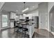 Modern kitchen with white cabinets, granite countertops, stainless steel appliances, and a breakfast bar at 179 Carter Rd, Auburn, GA 30011