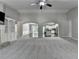 Open-concept living room with vaulted ceilings, fireplace, and seamless flow to the kitchen and dining area at 179 Carter Rd, Auburn, GA 30011