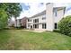 A well-maintained backyard features a stone patio perfect for outdoor dining at 2310 Norbury Se Cv, Smyrna, GA 30080