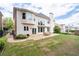Expansive backyard featuring a stone patio, manicured lawn, and well-maintained landscaping, perfect for outdoor entertaining at 2310 Norbury Se Cv, Smyrna, GA 30080