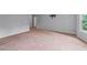 Large bedroom with neutral walls and carpeting with plenty of natural light at 2310 Norbury Se Cv, Smyrna, GA 30080