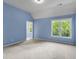 Spacious blue bedroom with natural light at 2310 Norbury Se Cv, Smyrna, GA 30080