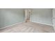Light filled bedroom with neutral colored walls and carpet, two entry doors, and a large window with outside views at 2310 Norbury Se Cv, Smyrna, GA 30080