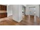 Open entryway with hardwood floors, white walls, and views into other rooms, offering a seamless transition at 2310 Norbury Se Cv, Smyrna, GA 30080