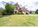 Charming two-story brick home with a well-kept lawn and two-car garage in a desirable neighborhood at 2310 Norbury Se Cv, Smyrna, GA 30080