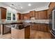 Well-lit kitchen features a center island and wood cabinets at 2310 Norbury Se Cv, Smyrna, GA 30080