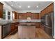 Gourmet kitchen features stainless steel appliances and dark countertops at 2310 Norbury Se Cv, Smyrna, GA 30080