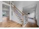 Grand foyer features a beautiful staircase with hardwood steps and white risers at 2310 Norbury Se Cv, Smyrna, GA 30080