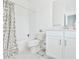 Clean bathroom featuring a tub with shower, patterned shower curtain, and a modern vanity with storage at 3313 Bartee Walk, Suwanee, GA 30024
