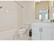 Bathroom features white subway tile, marble flooring, sleek white vanity, and modern fixtures at 3313 Bartee Walk, Suwanee, GA 30024