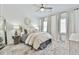 Inviting bedroom features a ceiling fan, plush rug, and decorative pillows on the bed at 3313 Bartee Walk, Suwanee, GA 30024