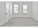 Neutral bedroom features plush carpet, plantation shutters, and ample natural light, creating a serene atmosphere at 3313 Bartee Walk, Suwanee, GA 30024