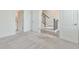Bedroom boasts neutral walls and carpet, with entrances to both the bathroom and staircase at 3313 Bartee Walk, Suwanee, GA 30024