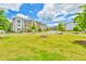 Neighborhood view of townhomes nestled within a well-maintained community at 3313 Bartee Walk, Suwanee, GA 30024