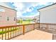 Outdoor deck with wood railings, offering neighborhood views at 3313 Bartee Walk, Suwanee, GA 30024