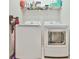 Laundry room with side-by-side washer and dryer units at 3313 Bartee Walk, Suwanee, GA 30024