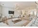 Open-concept living room with seamless flow to dining room and staircase at 3313 Bartee Walk, Suwanee, GA 30024