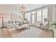 Cozy living room with large windows, plush seating, and decorative lighting at 3313 Bartee Walk, Suwanee, GA 30024