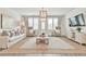 Well-lit living room with plush seating, decorative rug, and neutral decor at 3313 Bartee Walk, Suwanee, GA 30024