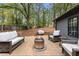 Backyard deck features comfortable seating around a modern fire pit at 410 Wilkinson Se Dr, Atlanta, GA 30317