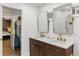 Elegant bathroom with double vanity, gold fixtures, mirrors, and access to a walk-in shower at 410 Wilkinson Se Dr, Atlanta, GA 30317