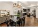Dining room featuring a modern chandelier, dining table with seating, and hardwood floors at 410 Wilkinson Se Dr, Atlanta, GA 30317