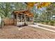 Inviting home with a covered front porch, wooden support beams, walkway, and a hanging swing at 410 Wilkinson Se Dr, Atlanta, GA 30317