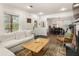 Cozy living room featuring a fireplace, sectional sofa, stylish decor, and hardwood floors at 410 Wilkinson Se Dr, Atlanta, GA 30317