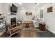 Comfortable living room with a fireplace, white sectional sofa, and stylish decor at 410 Wilkinson Se Dr, Atlanta, GA 30317