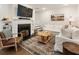 Bright living room with a white fireplace, hardwood floors, and a comfortable sectional sofa at 410 Wilkinson Se Dr, Atlanta, GA 30317