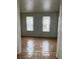 Bedroom featuring wood-look flooring and windows offering natural light at 458 Prince Of Wales, Stone Mountain, GA 30083