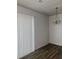 Dining room with wood-look flooring and bright light fixture at 458 Prince Of Wales, Stone Mountain, GA 30083