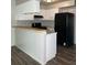 Open kitchen featuring white cabinets, and a breakfast bar for casual dining at 458 Prince Of Wales, Stone Mountain, GA 30083