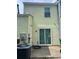 Rear exterior featuring siding, sliding glass doors to the patio, and an air conditioning unit at 458 Prince Of Wales, Stone Mountain, GA 30083