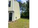 Side view of the home with a well kept lawn and external antenna at 458 Prince Of Wales, Stone Mountain, GA 30083
