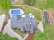 Aerial view showing the roof, pool, deck, garden, and lawn of the property at 8117 Spivey Rd, Jonesboro, GA 30236